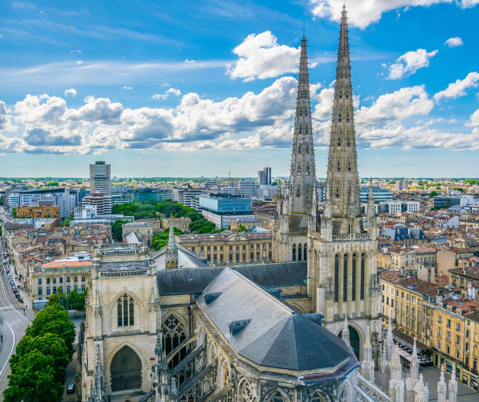 Skyline of Bordeaux city. Blue Skies with gothic spiers reaching high above the city. Limestone buildings
