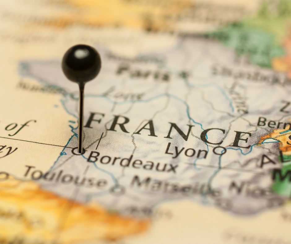 Old World map of France with pin in the city of Bordeaux in the Southwest of the country