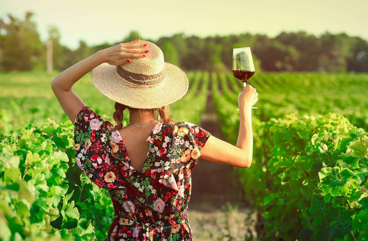 Asian woman drinking red wine