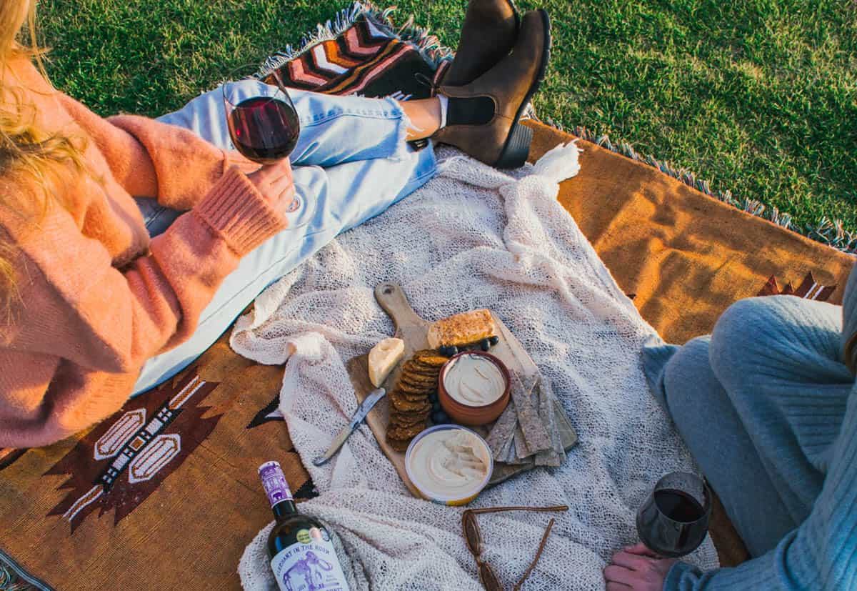 picnic beaujolais-1 Couple having a picnic and drinking Beaujolais wine