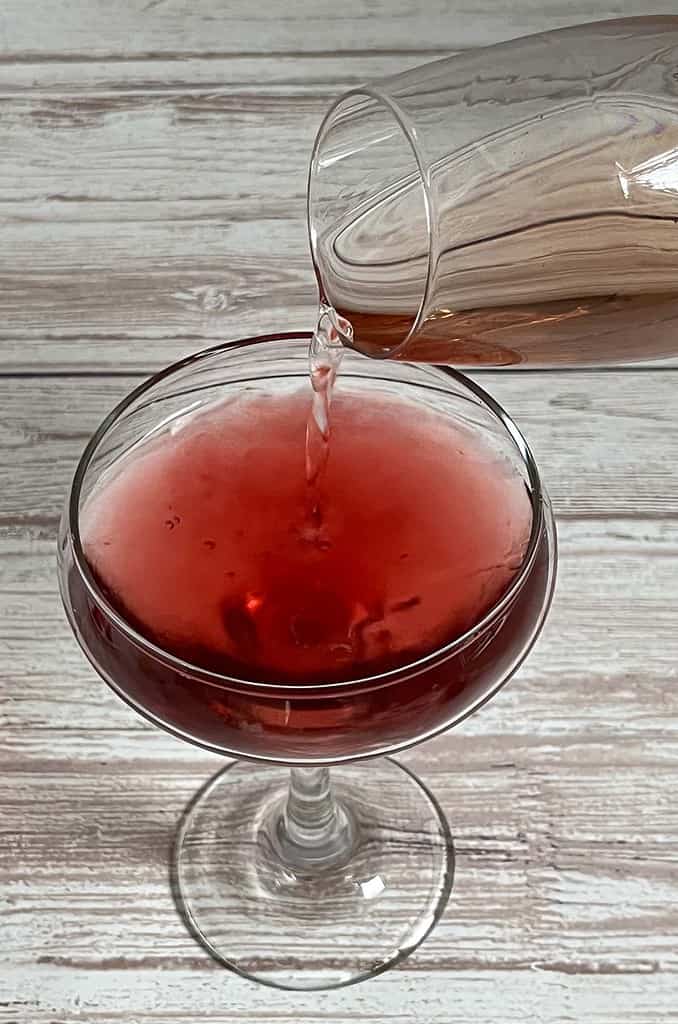 Adding Rose wine to the Coupe Glass