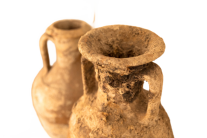 Two ancient clay pots shown using in early Rome to transport wine through these vessels.